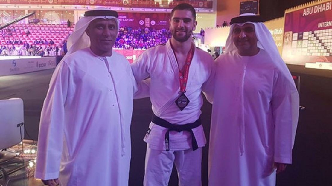 UASE Judo Federation president Mohammad Bin Thaloub Al-Darei poses with Israeli bronze medalist Peter Paltchick and Mr. Aref Al-Awani, General Secretary of Abu Dhabi Sports Council. 