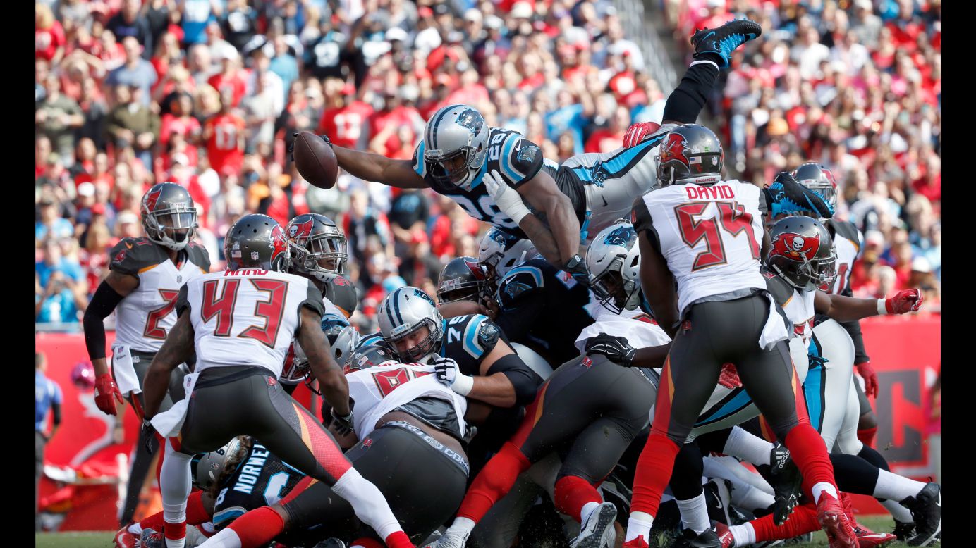 Carolina running back Jonathan Stewart leaps over the pile, scoring a touchdown during an NFL game in Tampa, Florida, on Sunday, October 29. Stewart and the Panthers defeated the Tampa Bay Buccaneers 17-3.