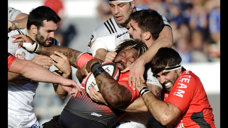Toulon's Mathieu Bastareaud is tackled by Brive players during a French league rugby match in Toulon on Saturday, October 28.