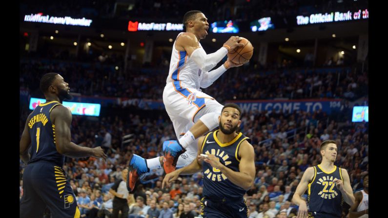 Oklahoma City guard Russell Westbrook rises above Indiana guard Cory Joseph during an NBA game in Oklahoma City on Wednesday, October 25.