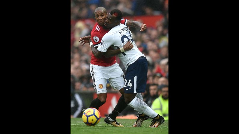 Manchester United's Ashley Young, left, collides with Tottenham's Serge Aurier during a Premier League match in Manchester, England, on Saturday, October 28.