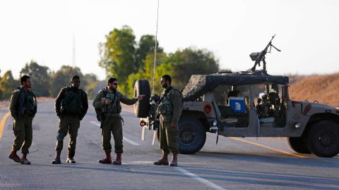 Israeli soldiers block a road close to the Israeli border with Gaza on October 30 in southern Israel. The Israeli military blew up a tunnel leading into Israel from Gaza.