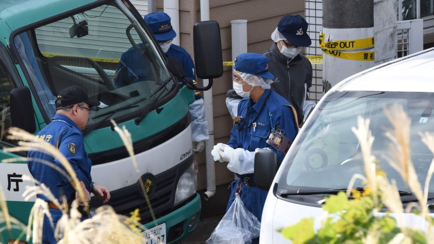 Policemen gather in front of an apartment where Japanese police found nine bodies, including two with their heads severed and dumped in a cool box in Zama, Kanagawa prefecture, on October 31, 2017.
The bodies were of eight women and one man, several media reported.  / AFP PHOTO / Toru YAMANAKA        (Photo credit should read TORU YAMANAKA/AFP/Getty Images)