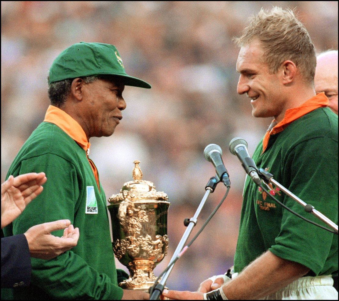 President Nelson Mandela congratulates South Africa's rugby team captain Francois Pienaar after his team's victory in the 1995 Rugby World Cup final. 