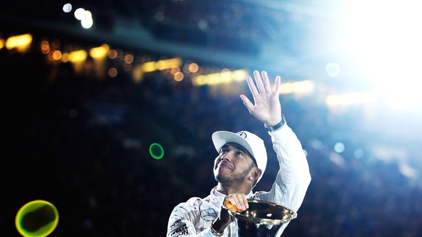 STUTTGART, GERMANY - DECEMBER 12: Lewis Hamilton of Great Britain and 2015 F1 World Champion waves to the crowd before the first round of races in the Mecedes-AMG A 45 of the Stars and Cars event at Mercedes-Benz Arena on December 12, 2015 in Stuttgart, Germany.  (Photo by Adam Pretty/Bongarts/Getty Images)