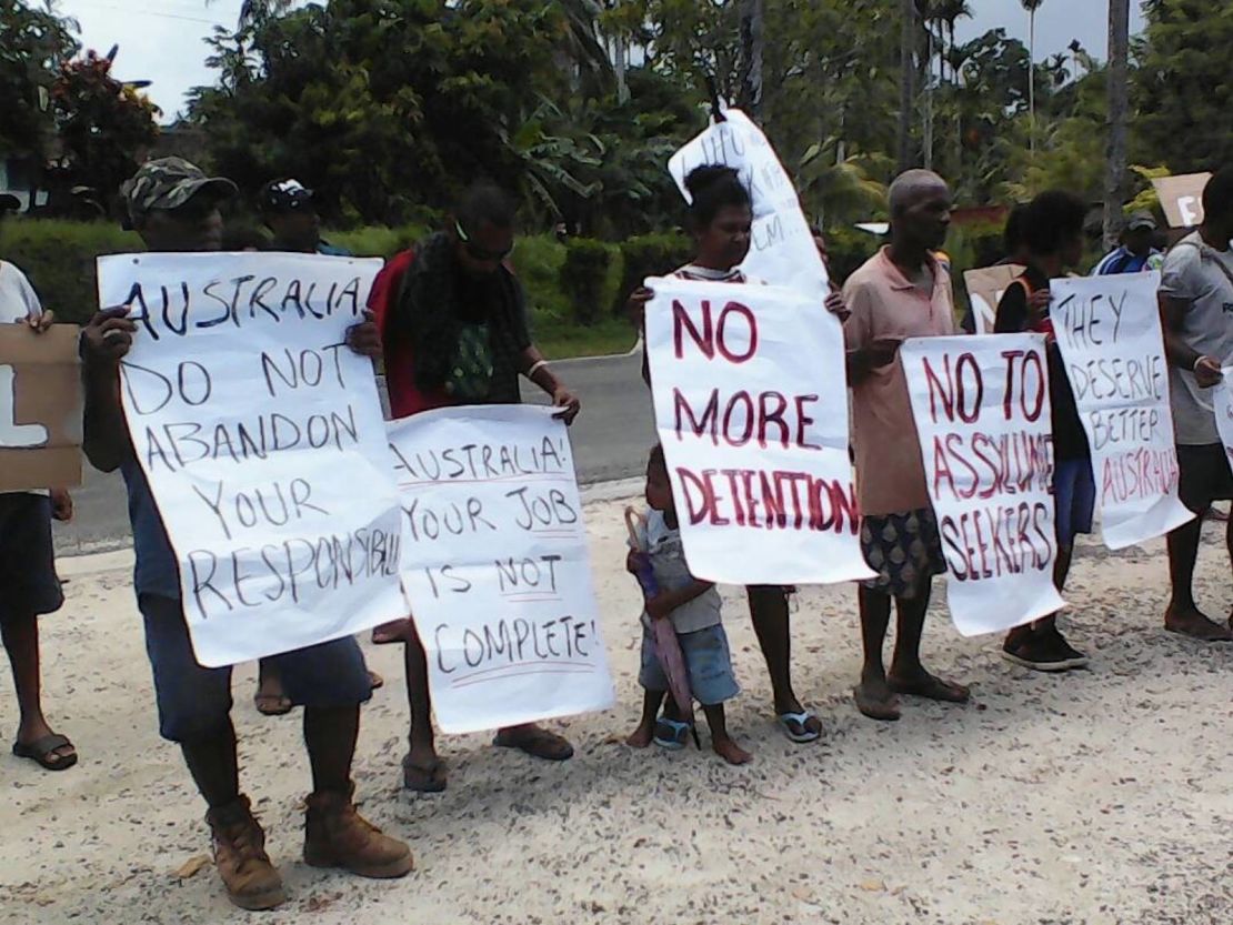 Manus Island locals hold signs at a protest calling for the refugees to be resettled elsewhere, on Tuesday, October 31.