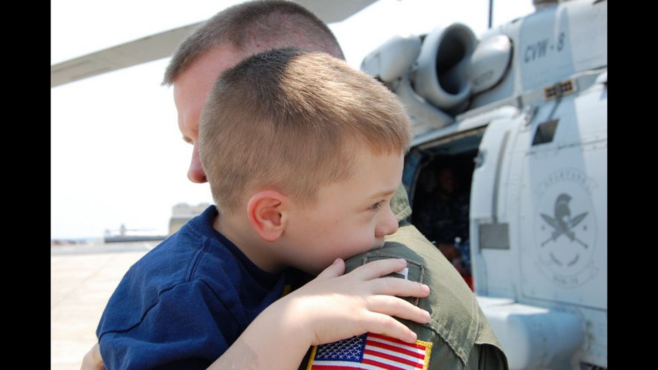 Landon hugs Anthony goodbye as he leaves on a deployment. 