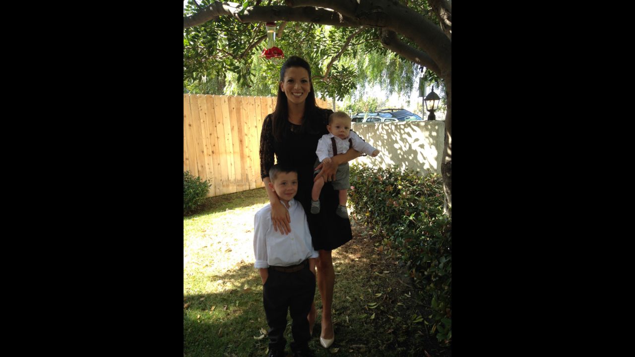 On the day of Landon's memorial service in October 2013, Theresa holds Anthony and Hunter close.