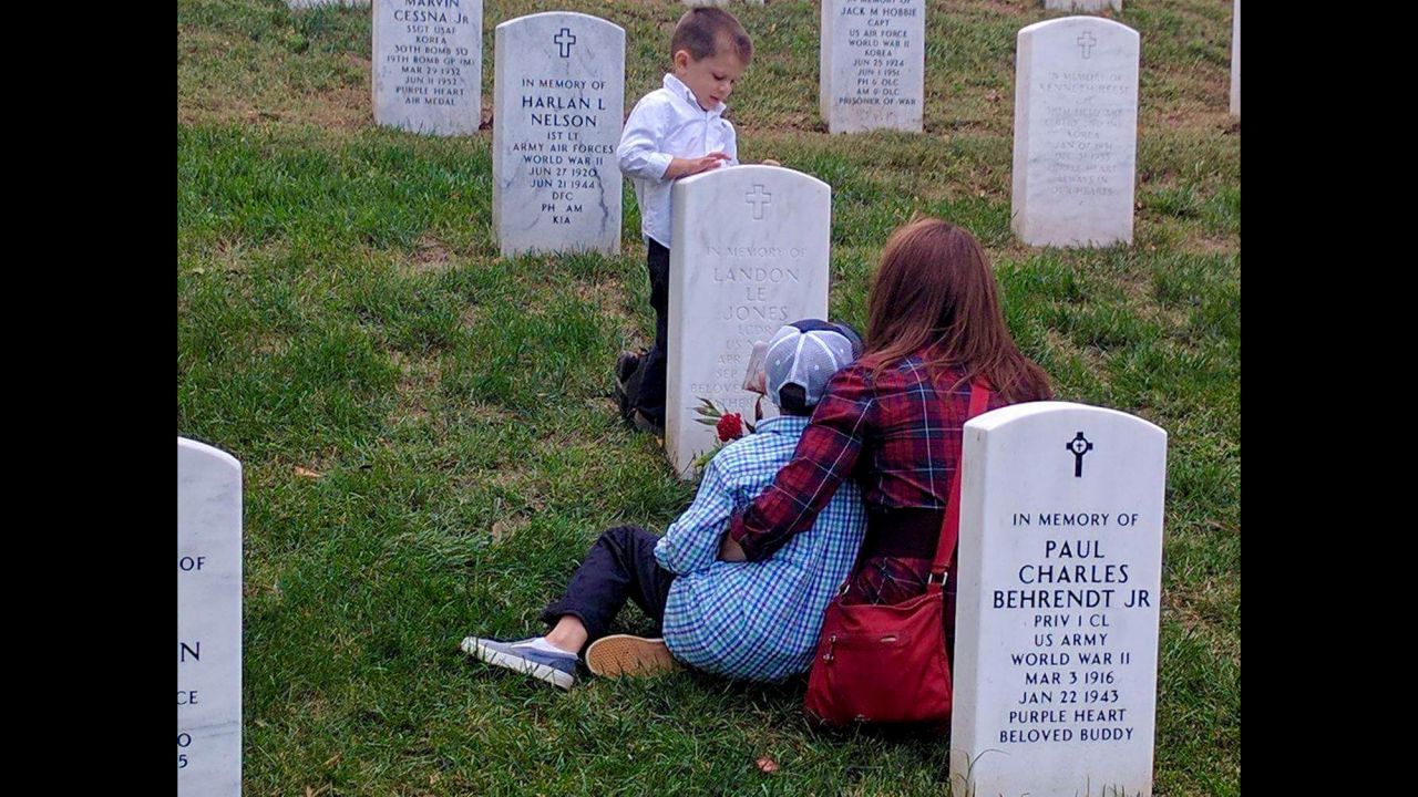 Theresa Jones and her sons Hunter and Anthony visited the gravesite of her husband and the boys' father -- US Navy Lt. Cmdr. Landon Jones in October 2016 during their first trip to Arlington National Cemetery outside Washington. Jones was killed in a 2013 Navy helicopter accident in the Red Sea. Click through the gallery for more family photos. 