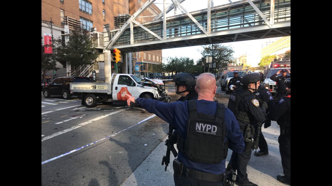 New York City police work in Manhattan after a rental truck drove down a busy bicycle path and struck people on Tuesday, October 31. At least eight people were killed in the incident, which is being investigated as terrorism, according to multiple law enforcement sources. A suspect is in custody.