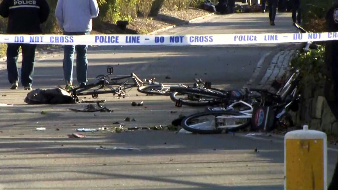 Parts of mangled bikes are strewn on the ground in Manhattan on Tuesday.