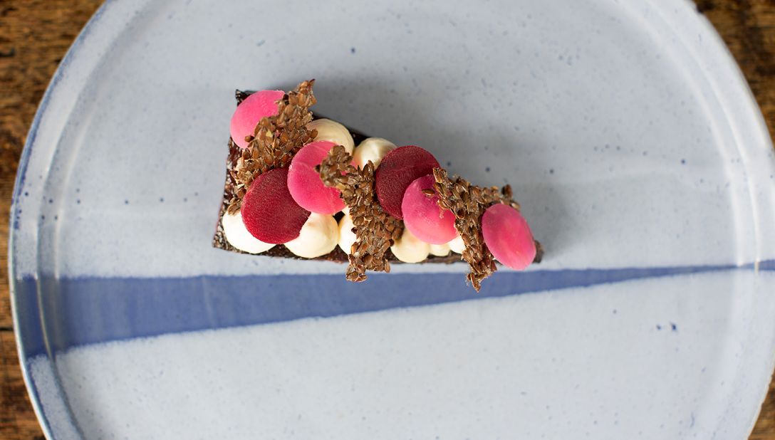 <strong>Crapaudine Beetroot: </strong>A Black Swan signature, this slice of home grown beet is cooked for hours in beef fat before being delicately decorated with piped goat curd and linseed crackers.