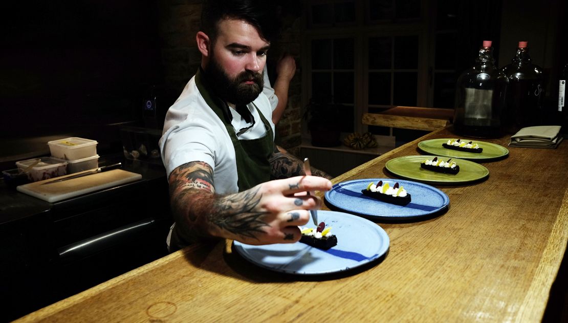 Diners can watch intricate dishes assembled in the open prep area.