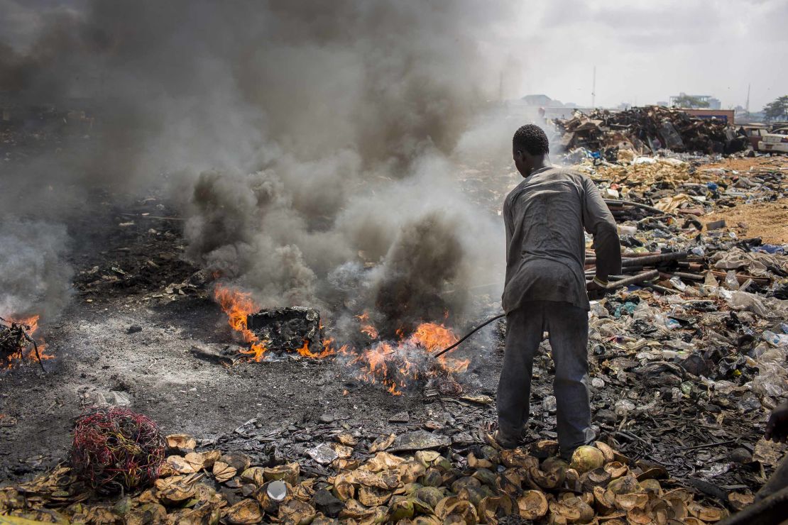 A man burns electronic waste on the biggest electronic scrap yard of Africa in Agbogbloshie, a district of the Ghanaian capital. 