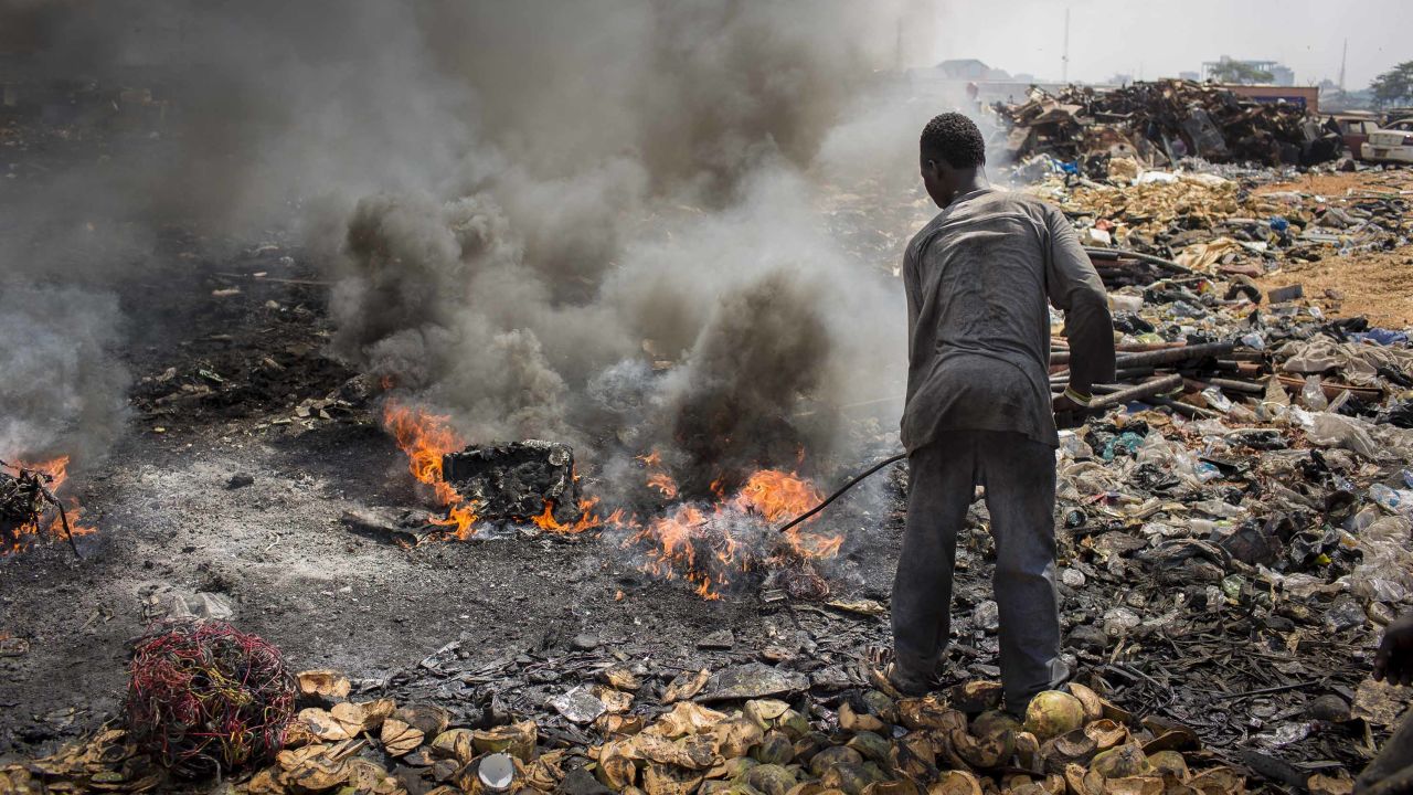 A man burns electronic waste on the biggest electronic scrap yard of Africa in Agbogbloshie, a district of the Ghanaian capital. 