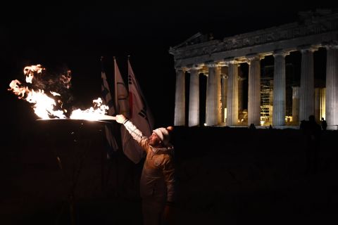 A succession of torchbearers carried the flame to the top of Acropolis Hill, where Greek gymnast Dimosthenis Tampakos (Olympic champion in the rings at Athens 2004) illuminated the columns of the Parthenon.