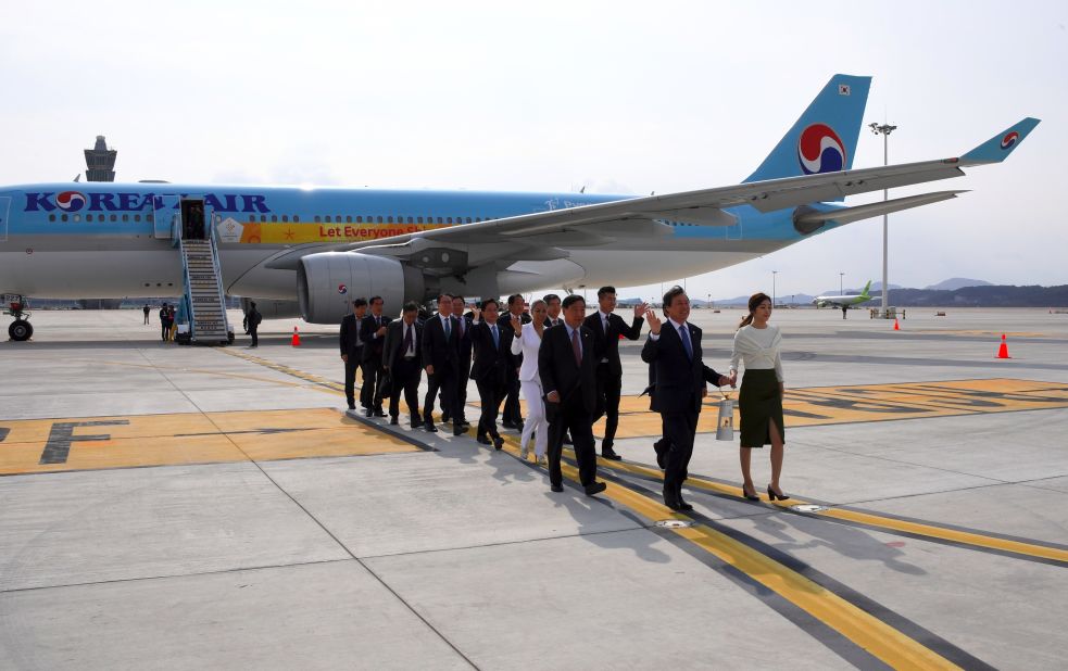 It touched down at Incheon International Airport, west of Seoul, in the safe hands of former figure skating champion Yuna Kim (R) and South Korea's Culture, Sports and Tourism Minister, Do Jong-Hwan.