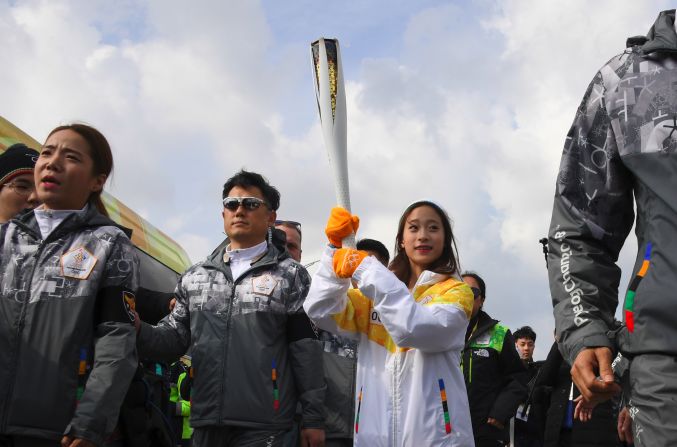 The honor of being the first to carry the Olympic flame on home soil fell to 13-year-old figure skating prodigy You Young. 