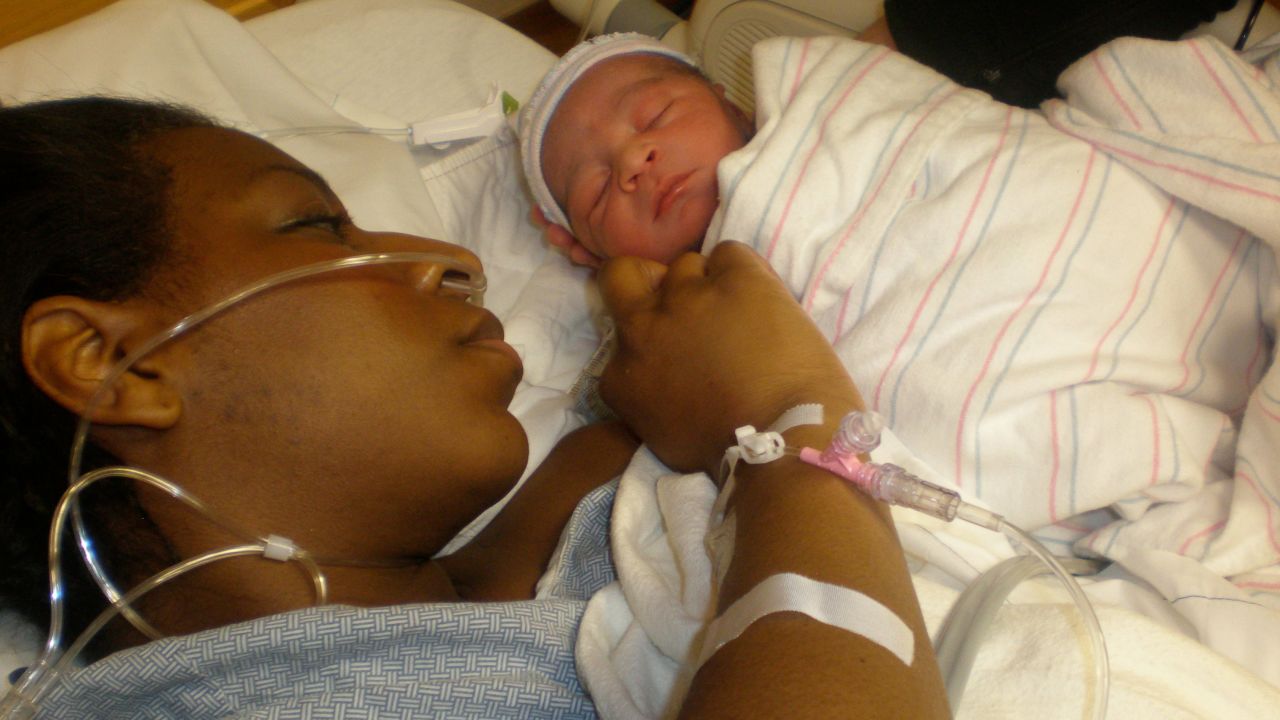 Timoria McQueen Saba and her newborn daughter Gigi in 2010. After giving birth to Gigi, Saba suffered postpartum hemorrhage.