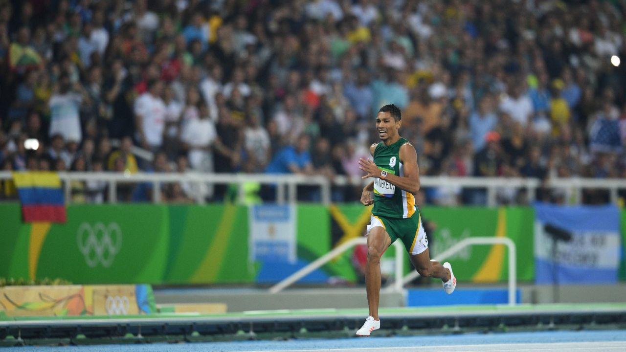 South Africa's Wayde van Niekerk competes in the Men's 400m Final during the athletics event at the Rio 2016 Olympic Games at the Olympic Stadium in Rio de Janeiro on August 14, 2016.   / AFP / Johannes EISELE        (Photo credit should read JOHANNES EISELE/AFP/Getty Images)