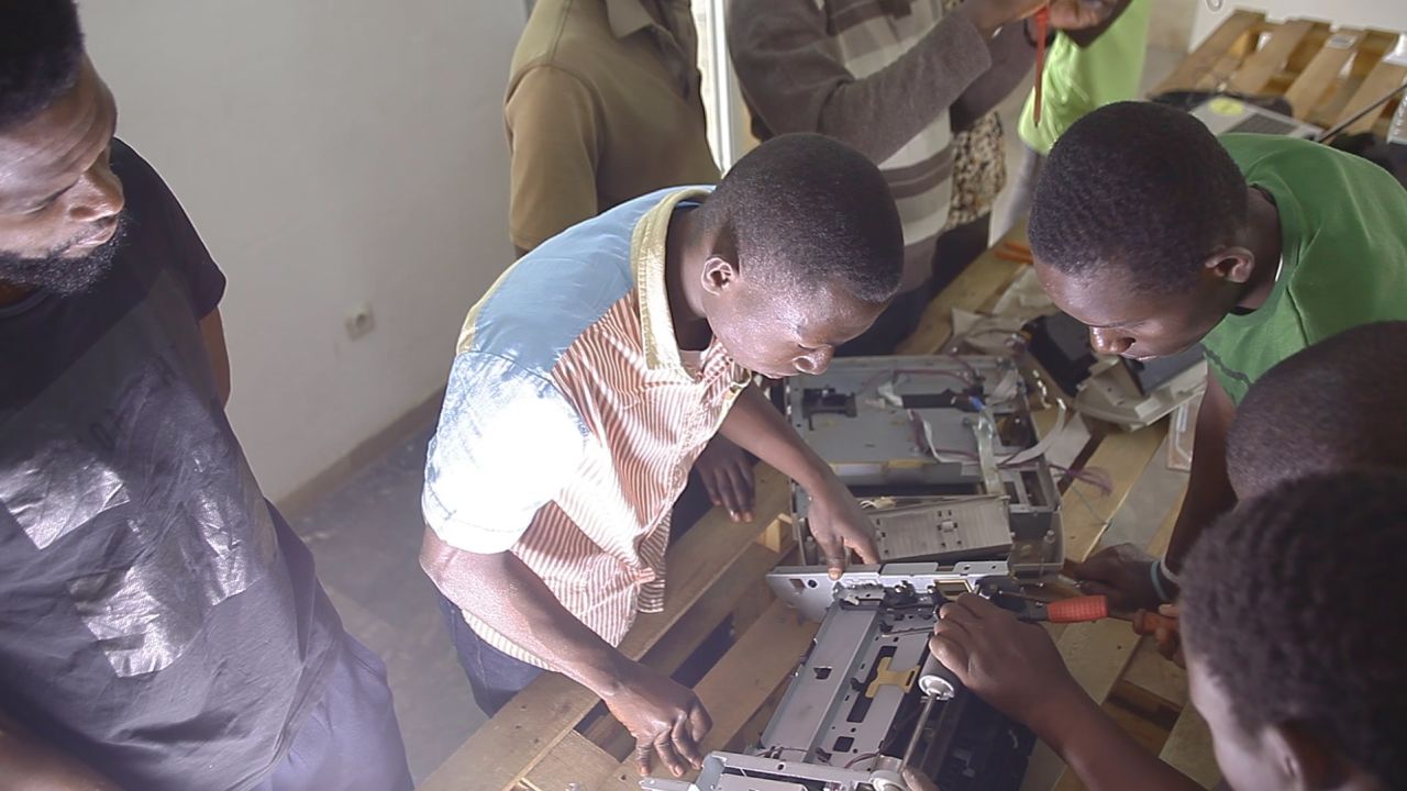 Innovators at WoeLab building 3D printers.