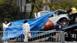 The Home Depot truck used in the bike path attack is removed from the crime scene, Wednesday, Nov. 1, 2017, in New York. (AP Photo/Mark Lennihan)