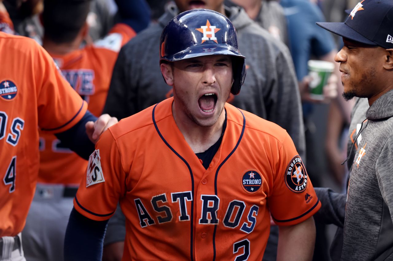 Bregman reacts after scoring the opening run of the game.