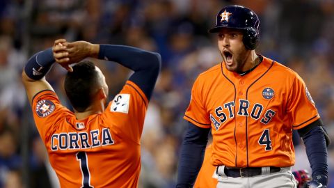George Springer of the Houston Astros, right, celebrates with teammate Carlos Correa in Game 7 of the World Series.