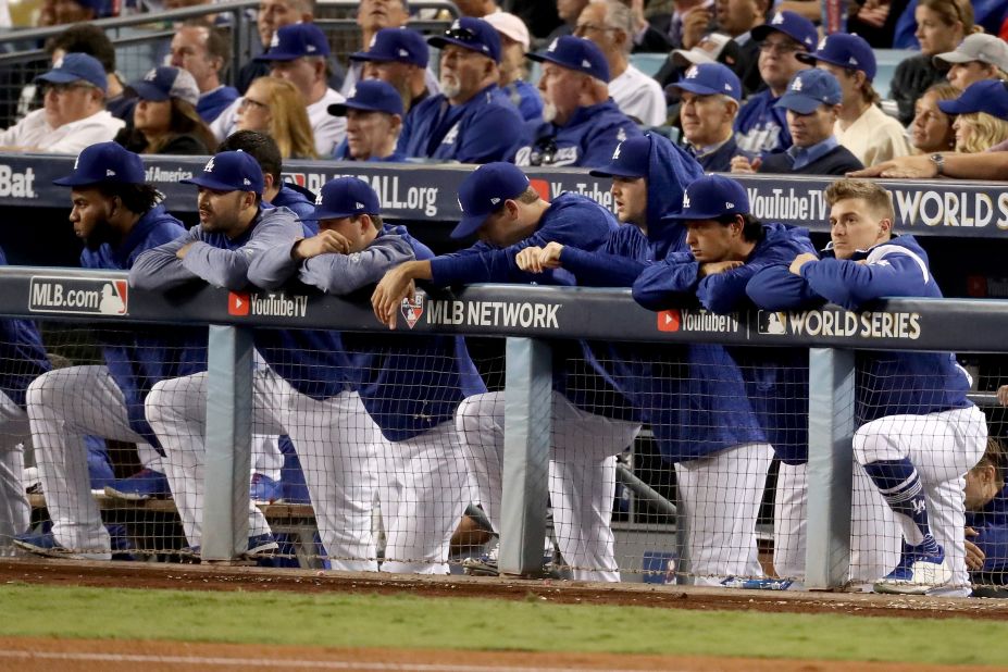 The Dodgers watch from the top step of the dugout during the eighth inning. They fell behind 5-0 after two innings and never got much momentum going.