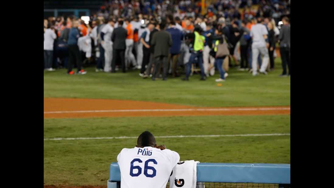 Dodgers outfielder Yasiel Puig watches the Astros celebrate.