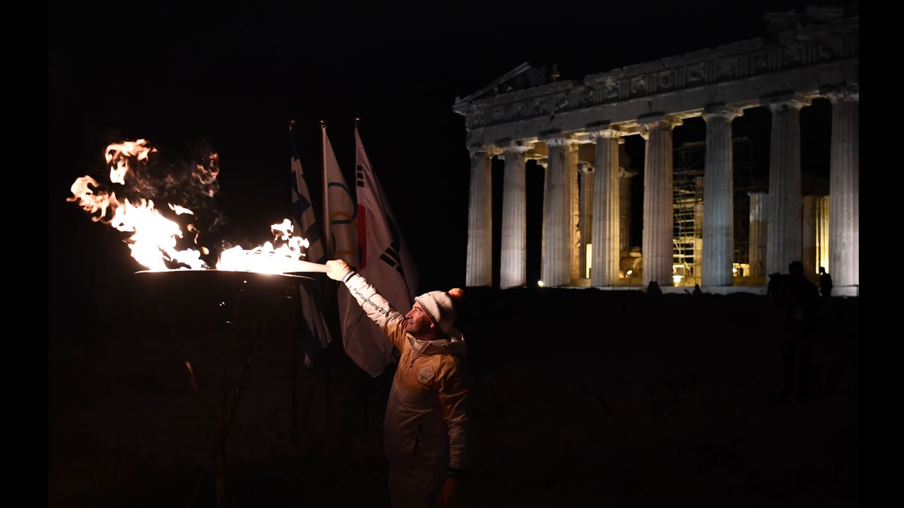 Greek gymnast Dimosthenis Tampakos lights the Olympic flame in front of the Parthenon in Athens, Greece, on Monday, October 30. The flame <a href="http://www.cnn.com/2017/11/01/sport/gallery/pyeongchang-2018-winter-olympics-torch/index.html" target="_blank">has arrived</a> in PyeongChang, South Korea, ahead of the 2018 Winter Olympics.