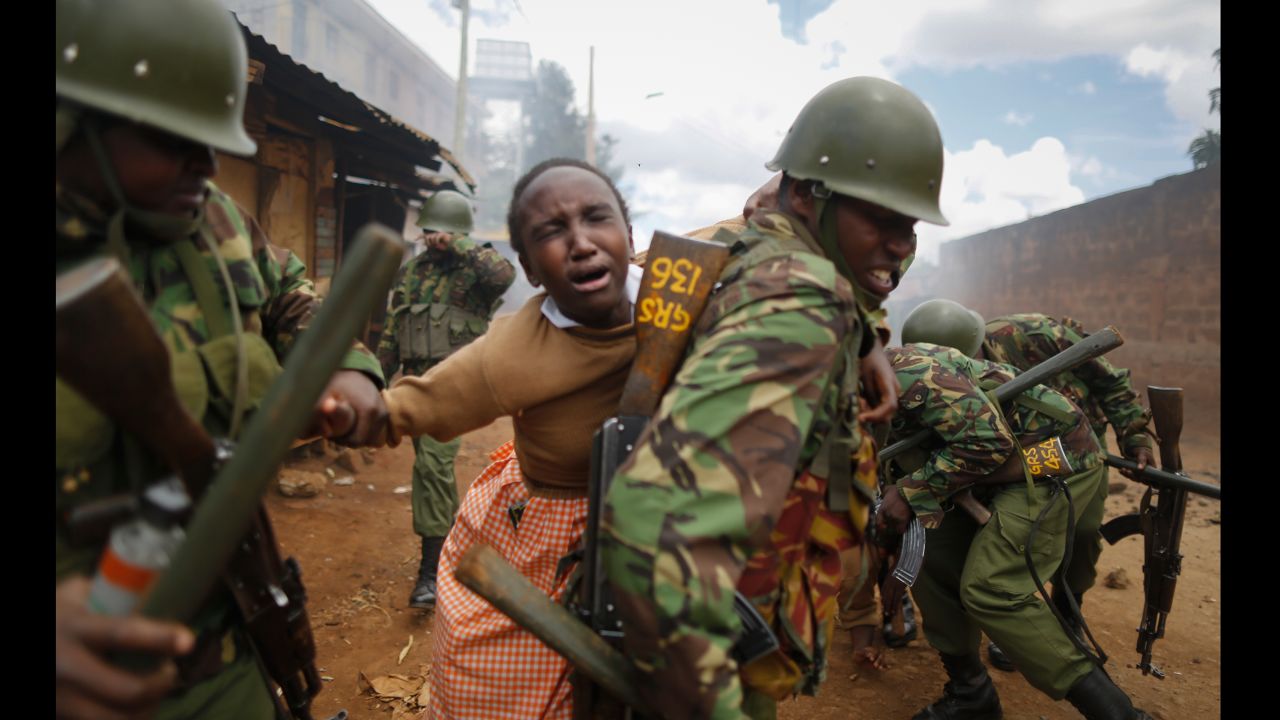 A police officer carries a schoolgirl on his back to get her away from clashes between police and protesters in Nairobi, Kenya, on Monday, October 30. She had been affected by tear gas. The full results of Kenya's election rerun <a href="http://www.cnn.com/2017/10/29/africa/kenya-election-rerun-results/index.html" target="_blank">are expected to be released Monday,</a> capping off months of drama and sporadic violence that has highlighted ongoing discord in the country.