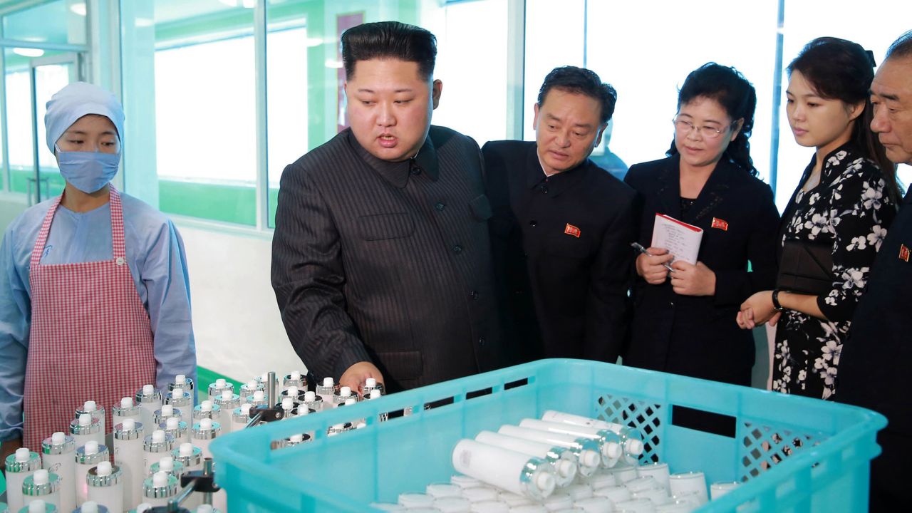 In this undated photo released Sunday, October 29, by the North Korean government, North Korean leader Kim Jong Un, second from left, inspects products <a href="http://www.cnn.com/2017/10/30/asia/north-korea-bombers-cosmetics/index.html" target="_blank">while visiting a cosmetics factory</a> in Pyongyang, North Korea. He was accompanied by his wife, Ri Sol Ju, second from right. She rarely appears in public and was recently reported to have given birth to the couple's third child.