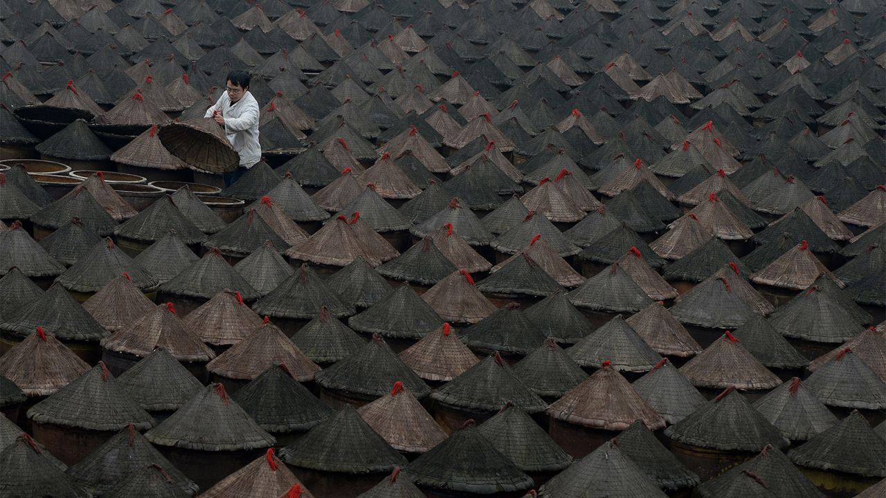 <strong>Chili peppers: </strong>Chongqing hotpot is known for its tongue-numbing chili pepper tripe broth. Here are some of the 5,000 pots of chilli peppers fermenting at a hot pot museum and factory in Chongqing.