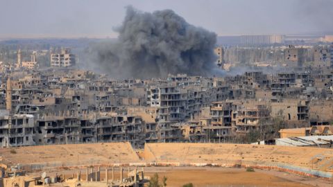 Smoke billows from Deir Ezzor during an operation against ISIS fighters on Thursday.