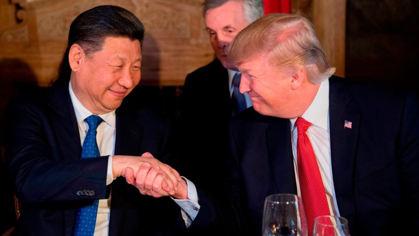 TOPSHOT - US President Donald Trump (R) and Chinese President Xi Jinping (L) shake hands during dinner at the Mar-a-Lago estate in West Palm Beach, Florida, on April 6, 2017. / AFP PHOTO / JIM WATSON        (Photo credit should read JIM WATSON/AFP/Getty Images)