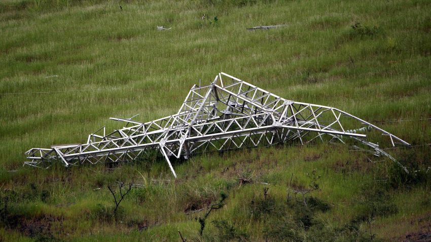 A twisted power distribution line tower is crumpled on the ground on October 28, 2017 after the passing of Hurricane Maria in Guayama, Puerto Rico.
Conditions in Puerto Rico are still heartbreaking more than five weeks after Hurricane Maria wrought devastation, with the lack of power and clean water compounding chronic conditions, medics say. Not only are there medication shortages, but the lack of power makes long-term care difficult at home for those with chronic conditions. / AFP PHOTO / Ricardo ARDUENGORICARDO ARDUENGO/AFP/Getty Images