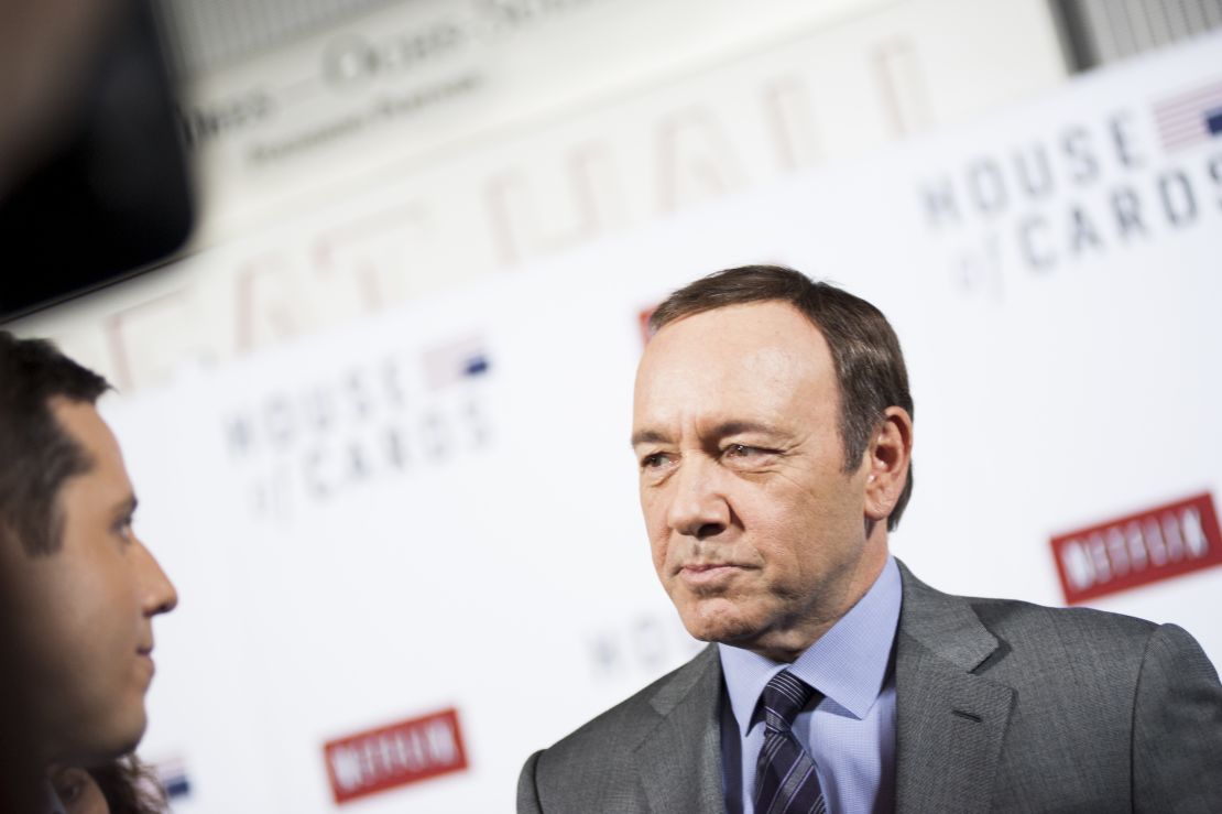 Kevin Spacey speaks with members of the press on the red carpet during Netflix's "House Of Cards" screening in Washington, DC on January 29, 2013.