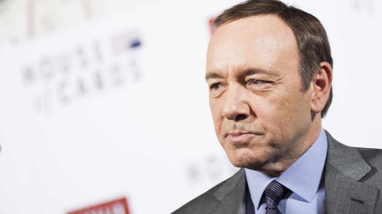 Kevin Spacey speaks with members of the press on the red carpet during Netflix's "House Of Cards" screening in Washington, DC on January 29, 2013.
