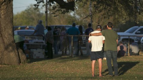 People comfort each other at a community center near the scene of the deadly shooting. 