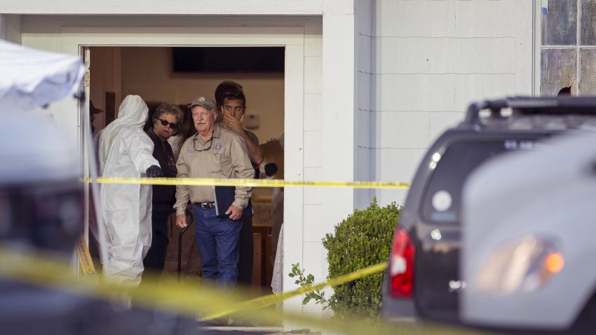 Investigators work at the scene of a mass shooting at the First Baptist Church in Sutherland Springs, Texas,  on Sunday, Nov. 5, 2017. A man opened fire inside of the church in the small South Texas community on Sunday, killing more than 20 people.(Jay Janner/Austin American-Statesman via AP)