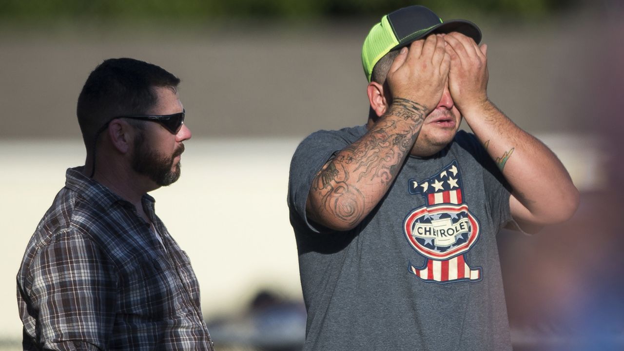 A man wipes his eyes after a deadly shooting at the First Baptist Church in Sutherland Springs, Texas, Sunday, Nov. 5, 2017. A man opened fire inside of the church in the small South Texas community on Sunday, killing more than 20 people. (Nick Wagner/Austin American-Statesman via AP)