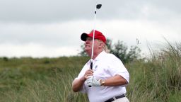 ABERDEEN, SCOTLAND - JULY 10:  Donald Trump plays a round of golf after the opening of The Trump International Golf Links Course on July 10, 2012 in Balmedie, Scotland. The controversial ?100m course opens to the public on Sunday July 15. Further plans to build hotels and homes on the site have been put on hold until a decision has been made on the building of an offshore windfarm nearby. (Photo by Ian MacNicol/Getty Images)