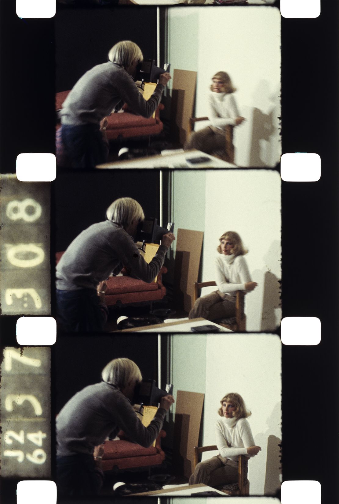 Andy Warhol at work at his studio in New York, c.1985.