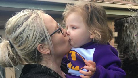 Ebony kisses three-year-old Ivy.