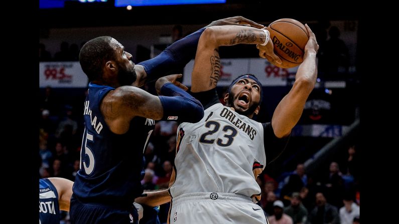 New Orleans forward Anthony Davis is defended by Minnesota's Shabazz Muhammad during an NBA game on Wednesday, November 1.