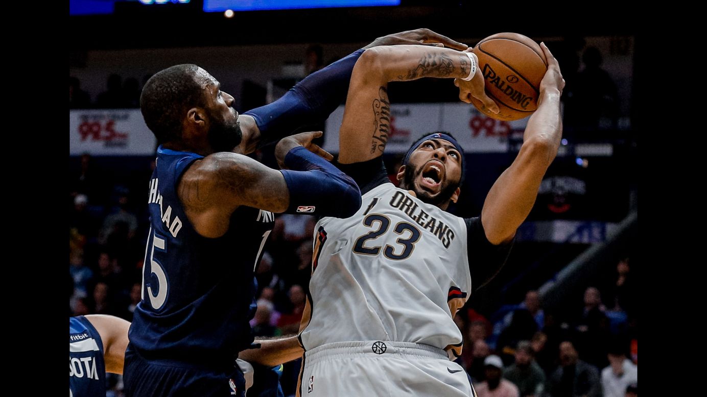 New Orleans forward Anthony Davis is defended by Minnesota's Shabazz Muhammad during an NBA game on Wednesday, November 1.