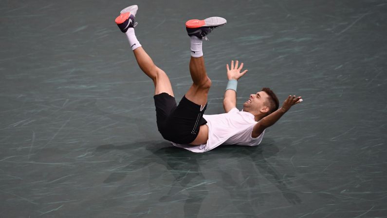 Filip Krajinovic celebrates his win over John Isner in the semifinals of the Paris Masters on Saturday, November 4.