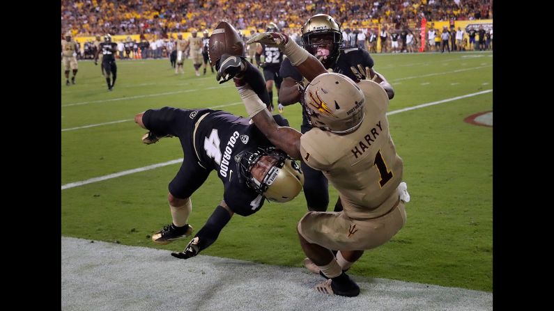 Colorado defensive back Dante Wigley, left, breaks up a pass intended for Arizona State wide receiver N'Keal Harry during a college football game in Tempe, Arizona, on Saturday, November 4.