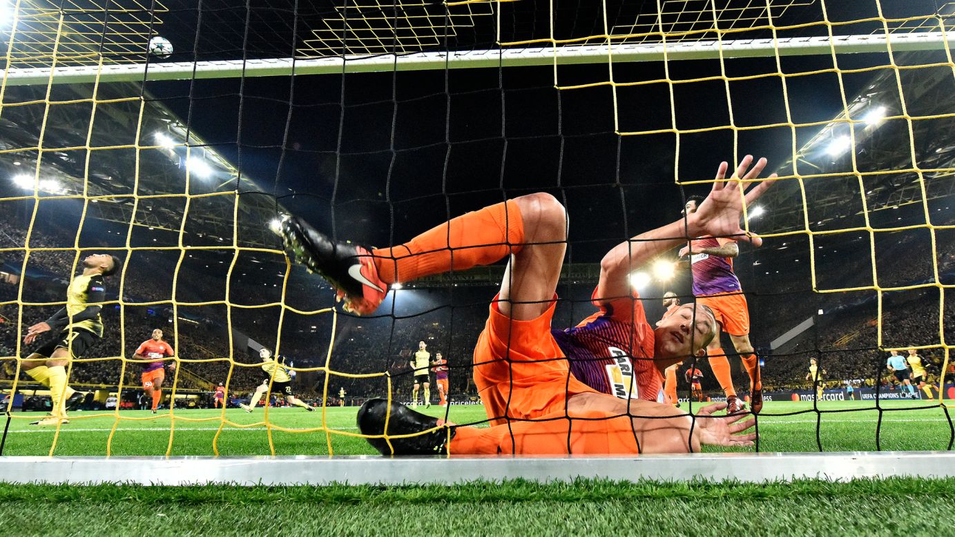 Jesus Rueda, a defender for Cypriot soccer club APOEL, falls into the goal during a Champions League match against Borussia Dortmund on Wednesday, November 1.